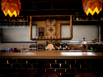 Warm-lit bar with hanging tulip lamps